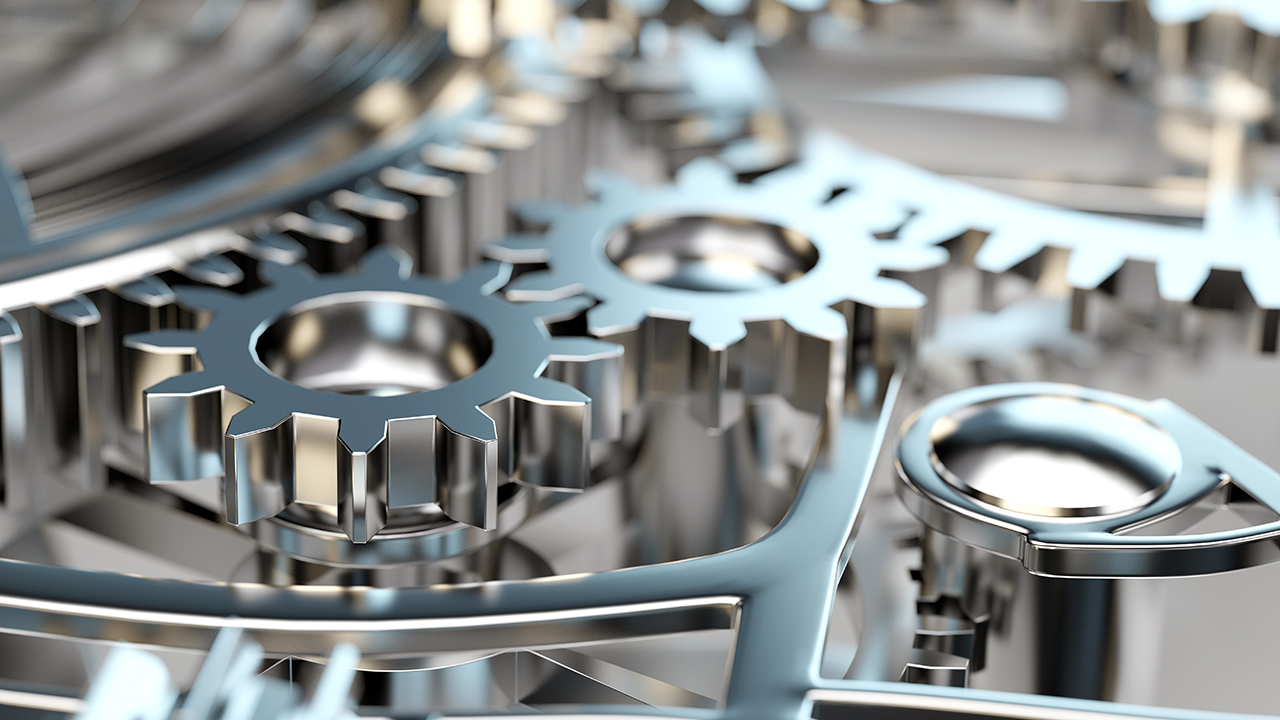 Viele Zahnräder in Maschine oder Motor als Konzept für Zusammenarbeit